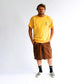FORMER Kiddo T-shirt in MERCH GOLD - Destroyed By Dane Collection